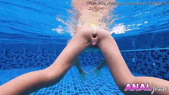 Asian Girl Swims with Big Butt Plug