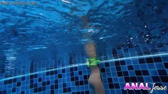 Asian Girl Swims with Big Butt Plug